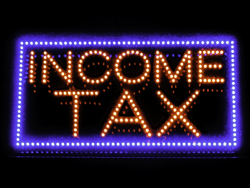 Neon sign in window of local accounting service